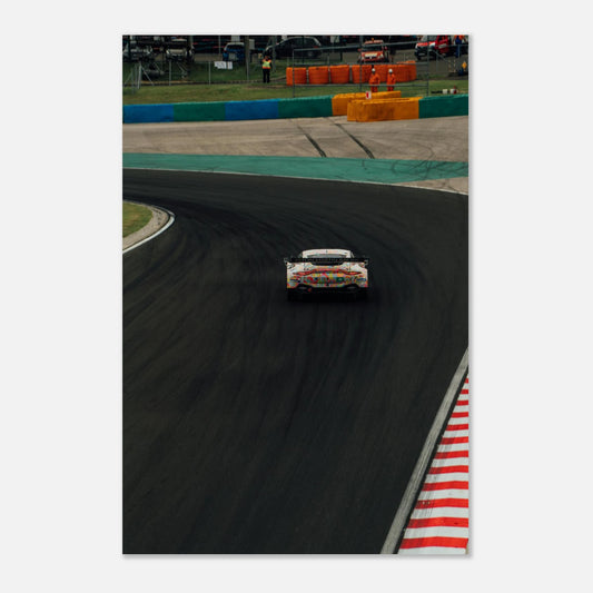 Race car on a track with a white border