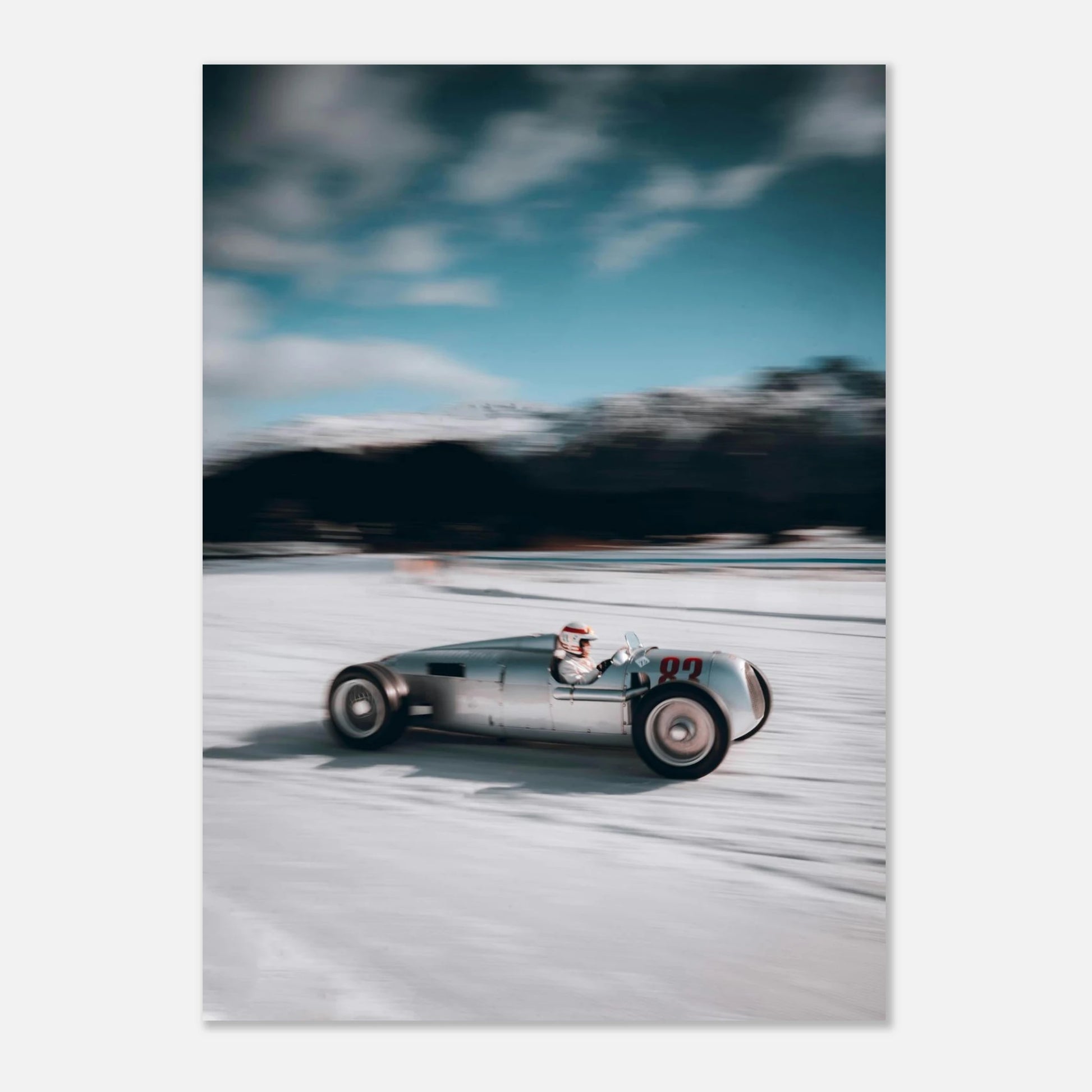 Vintage racing car poster on a snowy track with a blue sky.