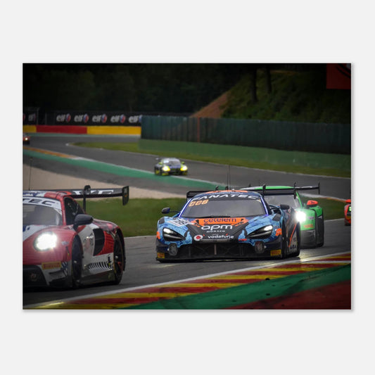 Racing cars on a track with visible branding and racing numbers.